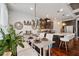 Open concept: a modern kitchen and adjacent dining area with barstool seating and hardwood floors at 2404 Fitts Dr, Conyers, GA 30094