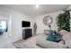 Cozy living room features an comfortable sectional sofa and wall-mounted TV at 2404 Fitts Dr, Conyers, GA 30094