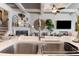 Bright and airy living room adjacent to kitchen featuring coffered ceilings and a fireplace at 2404 Fitts Dr, Conyers, GA 30094