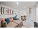 Upstairs living room with colorful accents, comfortable seating, and natural light at 2404 Fitts Dr, Conyers, GA 30094