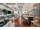 Open-concept living space featuring hardwood floors, stylish decor, and a kitchen island at 2404 Fitts Dr, Conyers, GA 30094