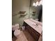 Bathroom featuring a single sink vanity, decorative shelves, and tile floors at 3587 Plum Creek Nw Trl, Kennesaw, GA 30152