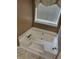 A soaking tub sits beneath a window with blinds in this neutral toned bathroom at 3587 Plum Creek Nw Trl, Kennesaw, GA 30152