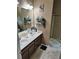 Bathroom showcasing a double sink vanity and a shower with glass doors at 3587 Plum Creek Nw Trl, Kennesaw, GA 30152