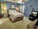 This is a primary bedroom with blue walls, a bed, and vanity with mirror at 3587 Plum Creek Nw Trl, Kennesaw, GA 30152