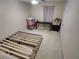 Bedroom featuring a bed frame on neutral carpet with an office set-up at 3587 Plum Creek Nw Trl, Kennesaw, GA 30152
