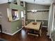 Dining room with hardwood flooring, neutral walls, and dining table with 4 chairs at 3587 Plum Creek Nw Trl, Kennesaw, GA 30152