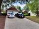 Wide driveway leading to a brick home with an attached two-car garage and lawn at 3587 Plum Creek Nw Trl, Kennesaw, GA 30152