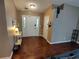 Foyer featuring hardwood floors, white trim, and a view into the main living area at 3587 Plum Creek Nw Trl, Kennesaw, GA 30152