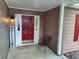 Inviting front porch with a charming red door, 'Welcome' sign, and side lighting at 3587 Plum Creek Nw Trl, Kennesaw, GA 30152