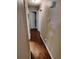 Hardwood hallway featuring access to doors and upper level at 3587 Plum Creek Nw Trl, Kennesaw, GA 30152
