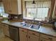 Featuring a kitchen sink in front of a window with a view to the outside at 3587 Plum Creek Nw Trl, Kennesaw, GA 30152