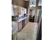 Bright kitchen with stainless steel appliances and neutral colored backsplash and cabinets at 3587 Plum Creek Nw Trl, Kennesaw, GA 30152