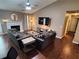 Comfortable living room featuring a fireplace, large sofas, and dark hardwood flooring at 3587 Plum Creek Nw Trl, Kennesaw, GA 30152