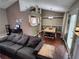 Open-concept living room flows into dining area, complete with hardwood floors at 3587 Plum Creek Nw Trl, Kennesaw, GA 30152