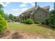 The backyard features a screened in porch, patio area, and ample lawn at 452 Rockford Pass, Marietta, GA 30064