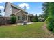 This property's backyard features a patio area, screened in porch and lawn at 452 Rockford Pass, Marietta, GA 30064