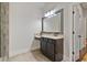 Bathroom vanity with granite countertop, dark cabinetry, and large framed mirror at 452 Rockford Pass, Marietta, GA 30064