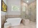 Modern bathroom features soaking tub, glass shower, and elegant fixtures at 452 Rockford Pass, Marietta, GA 30064