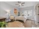 Bright bedroom featuring a cozy chair, and a ceiling fan for added comfort at 452 Rockford Pass, Marietta, GA 30064