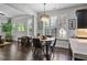 Bright dining area with large windows and hardwood floors, adjacent to the kitchen at 452 Rockford Pass, Marietta, GA 30064