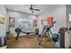 Upstairs exercise room with mounted TV, rowing machine and natural light at 452 Rockford Pass, Marietta, GA 30064