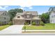 Charming two-story home with a two-car garage, manicured lawn, and attractive landscaping at 452 Rockford Pass, Marietta, GA 30064