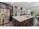 Bright kitchen with a large island, stainless steel refrigerator, and ample counter space at 452 Rockford Pass, Marietta, GA 30064