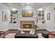 Comfortable living room with a stone fireplace, built-in shelves, and natural light at 452 Rockford Pass, Marietta, GA 30064