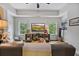 Inviting living room with trey ceilings, natural light, and media center at 452 Rockford Pass, Marietta, GA 30064