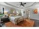 Relaxing main bedroom with tray ceiling, plantation shutters, and a cozy sitting area at 452 Rockford Pass, Marietta, GA 30064