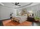 Relaxing main bedroom with tray ceiling, plantation shutters, and a cozy sitting area at 452 Rockford Pass, Marietta, GA 30064