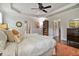 Spacious main bedroom features tray ceiling, ensuite bathroom, and walk-in closet at 452 Rockford Pass, Marietta, GA 30064