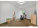 Bright office with a window, desk, chair, and decorative easel at 452 Rockford Pass, Marietta, GA 30064
