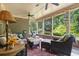 Screened-in patio with comfortable seating, ceiling fans, and string lights at 452 Rockford Pass, Marietta, GA 30064