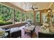 Relaxing screened-in patio with cozy seating and a view of the backyard at 452 Rockford Pass, Marietta, GA 30064