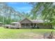 Spacious backyard features a covered deck, a wooden patio, and a well-kept lawn at 1667 Quail Run, Conyers, GA 30094