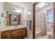 Bathroom featuring vanity with double mirrors, and separate toilet and bathtub shower areas at 1667 Quail Run, Conyers, GA 30094