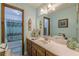 Light and airy bathroom with marble counters, wood cabinets, and a tub and shower combo at 1667 Quail Run, Conyers, GA 30094
