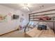 A cozy bedroom featuring a bunk bed, wall-mounted TV, ceiling fan, and playful decor at 1667 Quail Run, Conyers, GA 30094