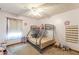 Colorful bedroom featuring a bunk bed, bright window with curtains, and carpet flooring at 1667 Quail Run, Conyers, GA 30094