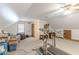 A large bonus room with a treadmill, desk, storage, and wood trim at 1667 Quail Run, Conyers, GA 30094