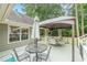 Spacious back deck featuring various seating, dining, gazebo, and easy access to the in-ground pool and yard at 1667 Quail Run, Conyers, GA 30094
