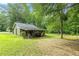 Quaint single-story home with a charming covered porch and a spacious, well-maintained lawn at 1667 Quail Run, Conyers, GA 30094