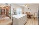 Eat-in kitchen featuring an island, wood floors, and plenty of natural light at 1667 Quail Run, Conyers, GA 30094