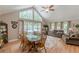Bright living and dining room with vaulted ceilings and large windows showcasing backyard pool at 1667 Quail Run, Conyers, GA 30094