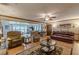 Spacious living room showcasing hardwood floors, comfortable seating, and a view into another room at 1667 Quail Run, Conyers, GA 30094