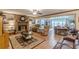 Cozy living room featuring a brick fireplace, plush seating, and warm lighting, perfect for relaxation at 1667 Quail Run, Conyers, GA 30094