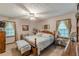 Serene bedroom with a queen-size bed, natural light, and neutral decor at 1667 Quail Run, Conyers, GA 30094