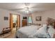 Cozy bedroom featuring a queen-size bed, neutral decor, and an ensuite bathroom at 1667 Quail Run, Conyers, GA 30094